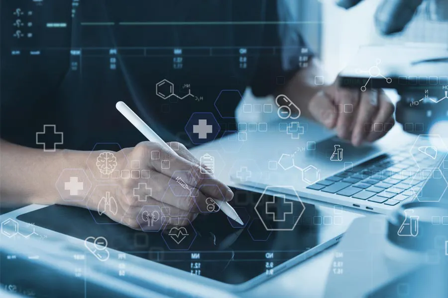 Health-Conditions-Treated-Doctor Close-up of a medical professional using a laptop and tablet, with illustrated medical symbols overlayed on the image, symbolizing health conditions treated by Vitality Medical in Seattle.