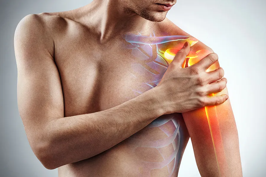 Rotator-Cuff-Clinic A man holds his shoulder; a 3D illustration of the musculo-skeletal shoulder is on the area. Get rotator cuff treatment from Vitality Medical in Seattle.